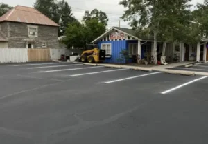 Sealcoated asphalt parking lot and driveway illustrating quality asphalt maintenance in Riverside, CA.